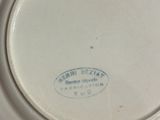 a white plate with a blue and white design on it