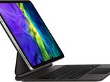 a close up of a laptop with a keyboard on top of it