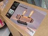a cardboard box with two light bulbs on top of it