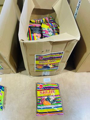 many boxes of candy sitting on the floor next to each other