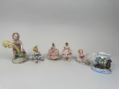 five figurines that are sitting on a table
