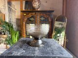 a glass bowl sitting on top of a wooden table