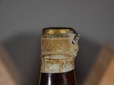 a close up of a bottle of beer on a table