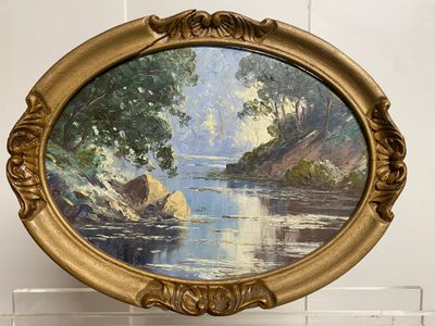 a picture of a painting of a river in a gold frame