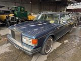 an image of a blue car parked in a garage