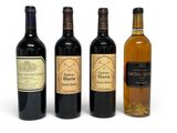 three bottles of wine are lined up on a white surface