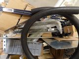 a picture of a pile of assorted items including a steering wheel