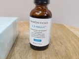 a bottle of skinceuticals on a table next to a box of soap