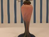 a vase with flowers in it sitting on a table