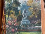 a painting of a statue in a garden on a easel