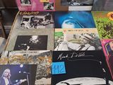 a lot of records on a table in a room