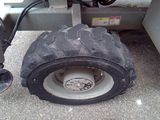 a tire that is sitting on the side of a truck