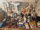 a table with many tools on it in a room