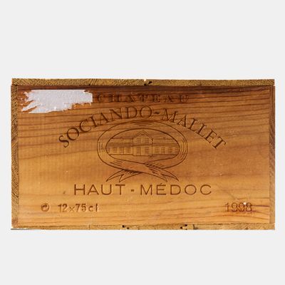 a wooden plaque with a picture of a fish on it