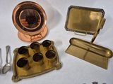 a gold tray with cups and spoons and a mirror
