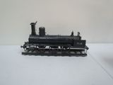 a toy train sitting on a white surface