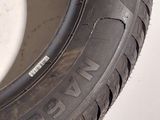 a close up of a tire on a white surface