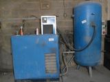 a blue water heater sitting next to a blue machine