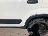 a white truck that is parked on the side of the road