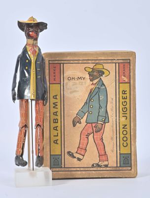 a figurine of a man standing next to a box of cigarettes