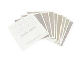a lot of papers and a keyboard on a white surface