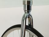 a close up of a bicycle tire with a light on it