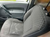 a picture of a car with a seat cover and a steering wheel
