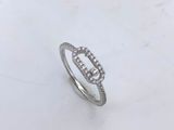 a close up of a diamond ring on a marble surface