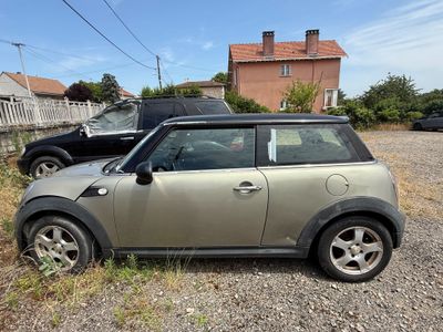 a small car that is parked on the side of the road