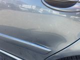 a close up of a car ' s door handle with a sticker on it