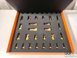 a box with chess pieces inside of it on a table