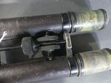 two old binoculars that are sitting on a table