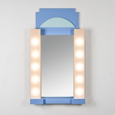 a blue vanity with a mirror and lights on it