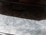 a microwave oven that is sitting on top of a wooden table