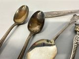 a lot of spoons and spoon spoons on the table