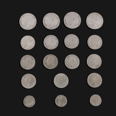 several different types of coins are arranged in a row on a black background