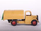 a toy truck that is yellow and has a green roof