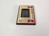 a close up of a small electronic device on a white surface