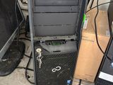 a lot of computer equipment that are sitting on the floor