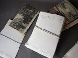a pile of papers with writing on them sitting on a table