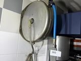 an image of a kitchen area with a sink and a shower head