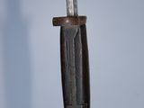 a knife that is hanging from a hook on the wall