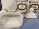 three porcelain urinals sitting on a blue table