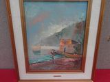 framed oil painting of a boat on the beach by a red tablecloth