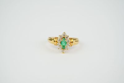 an oval emerald and diamond ring
