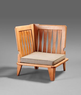 a wooden chair with a cushion on top of it
