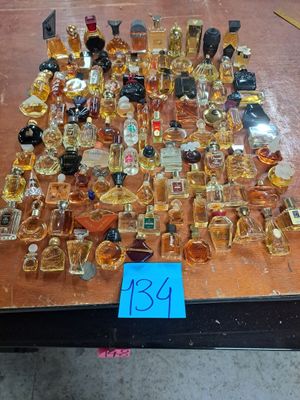 a table with a lot of bottles of perfume on it