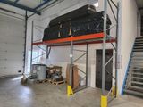 an image of a garage with a staircase and a storage area