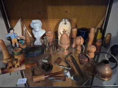 a glass case with a lot of different items on it