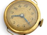 une montre de poche en or avec une trotteuse bleue